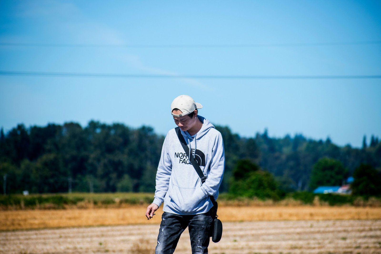 man standing on field at daytime