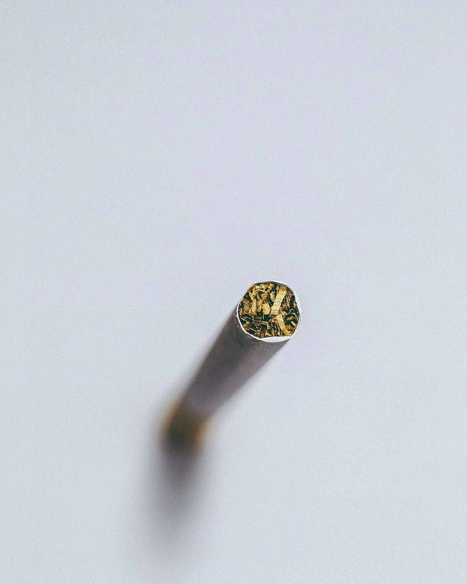 silver diamond ring on white surface